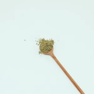 Botanical root powder in a spoon