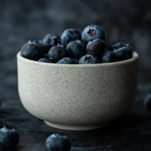 Dark berries in a bowl
