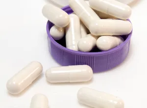 White capsules of L-Arginine amino acid