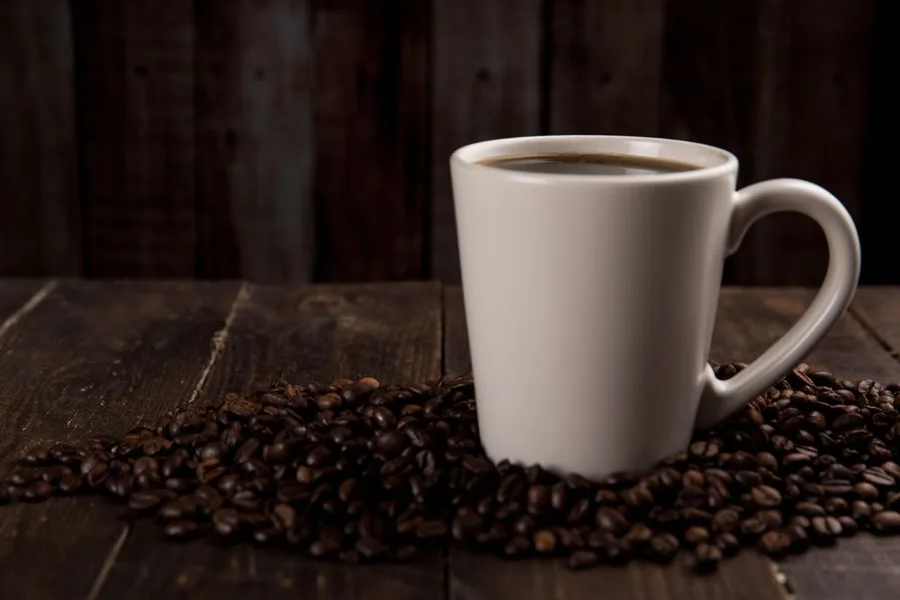 Morning coffee routine on a wooden table